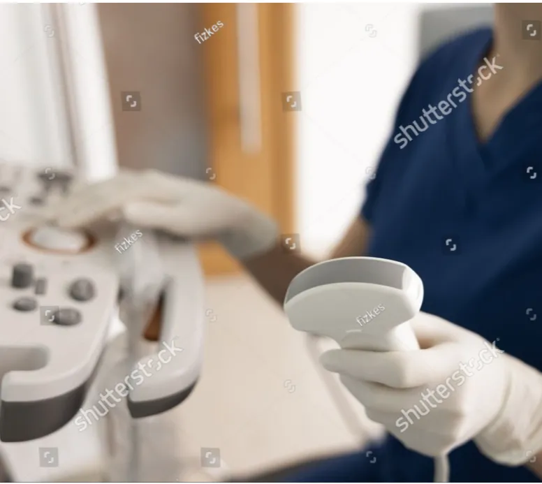 Sonographer preparing echocardiogram equipment